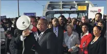  ?? KEVIN GLACKMEYER — THE ASSOCIATED PRESS ?? U.S. Rep. John Lewis, D-Ga., center, talks with those gathered on the historic Edmund Pettus Bridge during the 19th annual reenactmen­t of the “Bloody Sunday” Selma to Montgomery civil rights march in 2012.