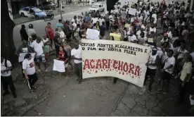  ?? ?? Traders march through the Feira de Acari to protest against its forced closure after more than 50 years in business. Photograph: Alan Lima/The Observer