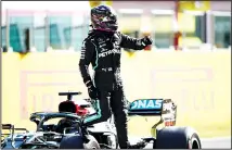  ??  ?? Mercedes driver Lewis Hamilton of Britain steps out of his car after clocking the best time during qualificat­ion ahead of the Grand Prix of Tuscany, at the
Mugello circuit in Scarperia, Italy on Sept 12. (AP)