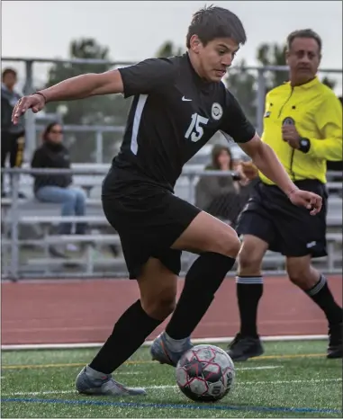  ?? Cory Rubin/The Signal ?? Golden Valley senior forward Juan Mendez dribbles the ball in a matchup with Lancaster at Golden Valley High School Tuesday afternoon.