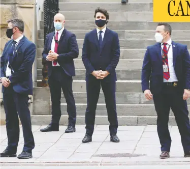  ?? BLAIR GABLE / REUTERS ?? Prime Minister Justin Trudeau waits to cross the street in Ottawa before a news conference on Tuesday. Trudeau's promises of “modest, short-term deficits” have flown straight out the window, writes John Ivison.