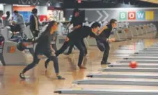  ?? John Leyba, The Denver Post ?? Students from various high schools get in some bowling practice and establish their averages at Brunswick Zone Wheat Ridge Lanes on Tuesday. The Colorado High School Bowling Federation has grown immensely since its inception in 2003.