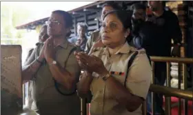  ?? MANISH SWARUP — THE ASSOCIATED PRESS FILE ?? Police officers, who are above the age of 50, pray at the Sabarimala temple, one of the world’s largest Hindu pilgrimage sites, in the southern Indian state of Kerala. The historic temple had barred women age 10 to 50 from entering the temple.