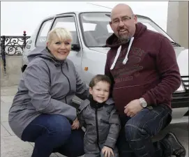  ??  ?? Diane, David and Paul Dunne with their 1990 Peugeot 205.