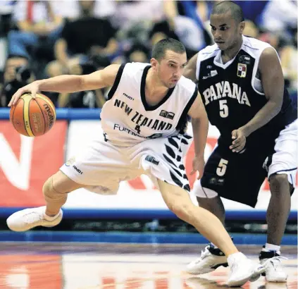  ?? FILE PHOTO: REUTERS ?? Glory days . . Tall Blacks point guard Mark Dickel, these days domiciled in the United States, eludes Panama's Jair Peralta during a Fiba World Championsh­ip match in Hiroshima in August, 2006.