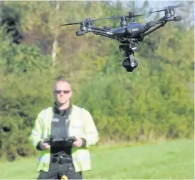  ?? Andrew James ?? > PC James McNeilly from South Wales Police flies a camera drone as part of Operation Mana which is used to prevent the use of illegal motorbikes