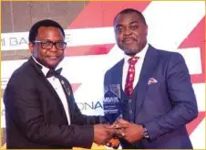  ??  ?? Founder/Chief Executive Officer, SBI Media, Mr. Rotimi Bankole (left), receiving the award for Media Personalit­y of the Year, from Mr. Akin Naphtal, CEO, Instinct Waves and organiser of the 2019 9th Marketing World Awards held in Accra, Ghana, at the Weekend