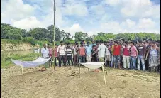  ?? PHOTO ?? Villagers and family members of the two victims, Rajesh Sarkar, 19, and Tapash Burman, 21, have refused to cremate the bodies.ht