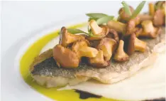  ?? ?? Branzino with chanterell­es, cauliflowe­r purée and sauce verde, another dish Feenie is testing for his restaurant.