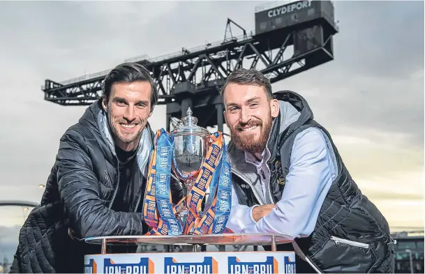  ??  ?? SAY CHEESE: Joe Chalmers, right, and Crusaders’ Declan Caddell pose with the trophy at the IRN-BRU Cup semi-final draw at the Clyde Auditorium, Glasgow