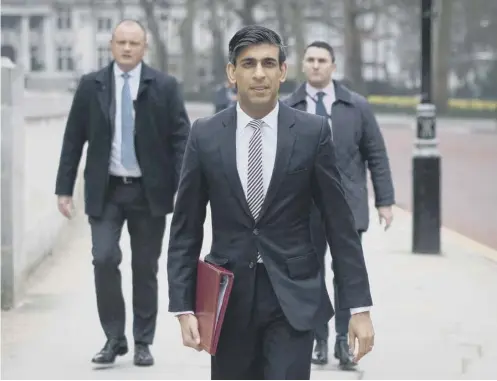  ??  ?? 0 Rishi Sunak, makes his way from the Treasury to No 11 Downing Street ahead of his Budget today