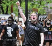  ?? MARSHALL GORBY / STAFF ?? Protesters marched for George Floyd down Main Street in Dayton on Saturday.