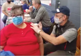  ?? BOB KEELER — MEDIANEWS GROUP ?? Betty Kulp, of Telford, gets vaccinated March 7by Greg Segner, pharmacist and former owner of Rann Pharmacy.