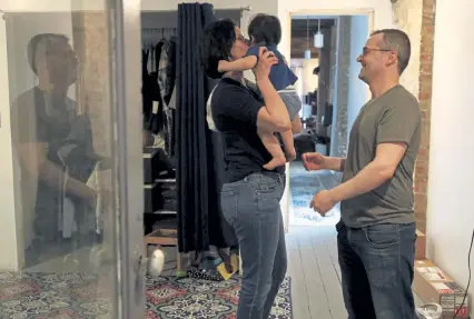  ??  ?? Troy Hernandez and his partner, Alexandra Reyes, enjoy time with their 1-year old son, Joaquin Hernandez, last week at their home in Chicago’s Pilsen neighborho­od. Hernandez spent $15,000 changing out lead pipes at the home before Joaquin’s birth.