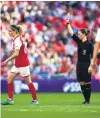  ?? PHOTO: GETTY IMAGES ?? The big time . . . Lindsey Robinson shows a yellow card to Arsenal defender Dominique Janssen during the women’s FA Cup final at Wembley earlier this month.