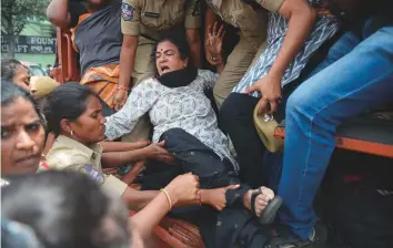  ?? AFP ?? Police detain Progressiv­e Organisati­on for Women leader Sandhya (centre) during a protest against the arrest of poet and activist Vara Vara Rao in Hyderabad yesterday.