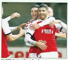  ??  ?? ALL OVER: Fleetwood Town’s Ched Evans is congratula­ted after scoring their third goal against Coventry