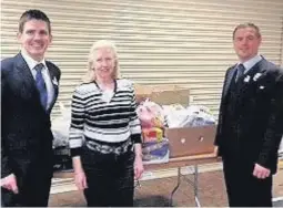  ??  ?? Thank you Thomas Marshall (left) and Brian Gilmour from the TSB make a donation of £100 of food to the Rutherglen and Cambuslang Foodbank