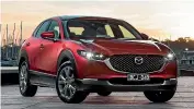  ?? THOMAS WIELECKI ?? Top compact/small SUV: Somehow the CX-30 slips in between the CX-3 and CX-5. Don’t ask us how, but it does it well.