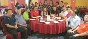  ??  ?? Kong (front fourth left) and Yiap (front sixth left) in a group photo at the farewell gathering.