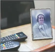  ?? (AP/Jon Super) ?? A photo of the late Muriel Bonner taken in Belgium in 1979 stands on a table in the home of her husband Gordon Bonner in Leeds, England.