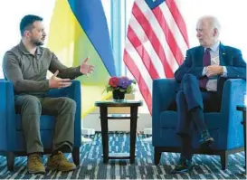  ?? SUSAN WALSH/AP ?? President Joe Biden, right, meets with Ukrainian President Volodymyr Zelenskyy on Sunday in Japan.