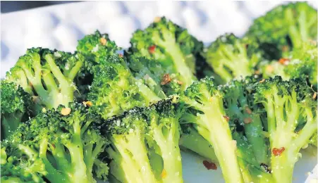  ??  ?? In this easy weeknight dish, broccoli florets are blanched and sautéed with garlic, anchovy, chili flakes and lemon zest.