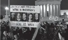  ?? Jacquelyn Martin/Associated Press ?? Protesters rally May 3 outside the U.S. Supreme Court after a draft opinion leaked, suggesting the justices were poised to overturn the 1973 Roe v. Wade case that legalized abortion.