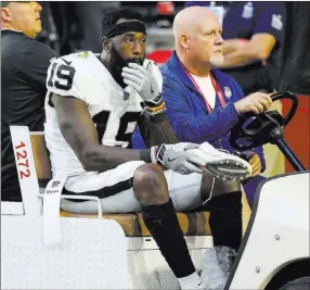  ?? Ross D. Franklin ?? The Associated Press Raiders receiver Brandon Lafell leaves the field after suffering a rupture to his left Achilles’ tendon Sunday in Glendale, Ariz. He is expected to be placed on injured reserve.