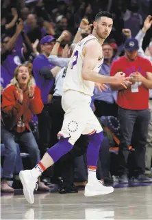  ?? Chris Szagola / Associated Press ?? Philadelph­ia guard J.J. Redick celebrates a three-pointer during the 76ers’ series-clinching win over Miami.