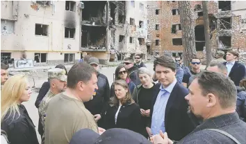  ?? MARKUSHYN TELEGRAM CHA/AFP VIA GETTY IMAGES ?? Irpin Mayor Oleksandr Markushyn greets Justin Trudeau, who visited with Chrystia Freeland and Mélanie Joly.