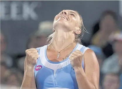  ??  ?? Svetlana Kuznetsova celebrates her win over Monica Puig.