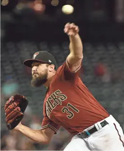  ?? MATT KARTOZIAN/USA TODAY SPORTS ?? Diamondbac­ks starting pitcher Caleb Smith throws in the first inning against the Brewers on Wednesday. Smith gave up one run over six innings of work.