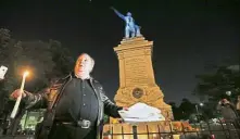  ??  ?? This must stay: Southern activist Charles Lincoln
speaking during a candleligh­t vigil at the statue of
Jefferson Davis in New Orleans. — AP