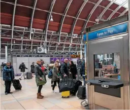 ?? JACK BOSKETT/ RAIL. ?? Passengers queue to buy tickets at London Paddington on March 3 2017. Progress has been slow on fares reform.