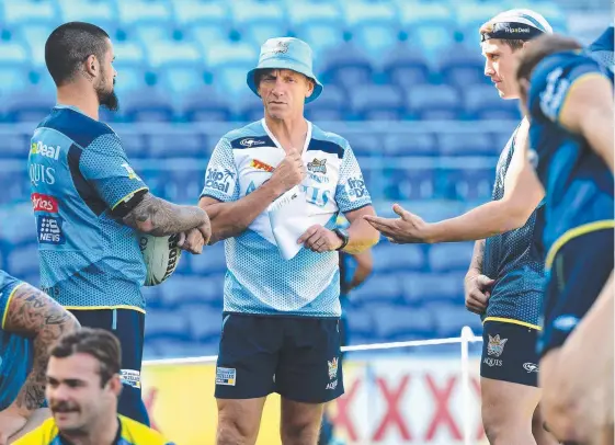  ?? Picture: AAP IMAGE ?? Neil Henry (centre) has been given the opportunit­y to see out the rest of the season before the Titans carry out a performanc­e review.