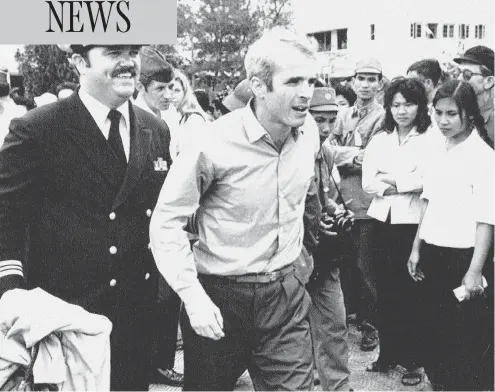  ?? HORST FAAS / THE ASSOCIATED PRESS FILES ?? John Mccain, who was captured while serving in the Vietnam War, is escorted to the airport in Hanoi, Vietnam in 1973 after his release.