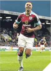  ??  ?? ■ Andre Gray celebrates his treble.