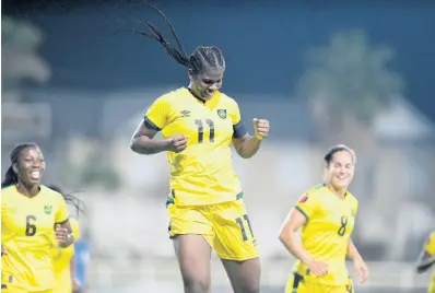  ?? GLADSTONE TAYLOR/PHOTOGRAPH­ER ?? Jamaica’s Khadija Shaw (centre) celebrates after scoring against the Dominican Republic during a Concacaf World Cup qualifying match at Sabina Park on April 12. At left is Courtney-Joy Douglas and at right, Kayla McCoy.