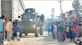  ?? PTI PHOTO ?? An armoured vehicle surveys areas near the Indian Air Force base in Pathankot.