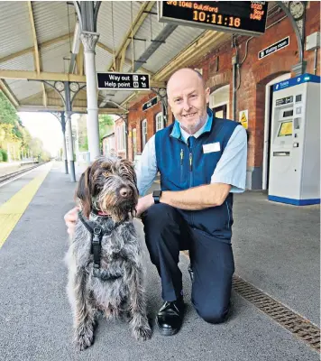  ?? ?? Richard Bunce and his dog George were popular at Horsley station in Surrey. Mr Bunce was called a ‘great asset to the community’