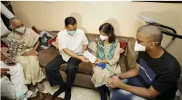  ?? — PTI ?? Chief minister Arvind Kejriwal meets the family of late Dr Aseem Gupta at their residence in New Delhi on Friday. Mr Gupta, 52, served in the frontline of the war against the pandemic at the government facility and died of the infection last week.