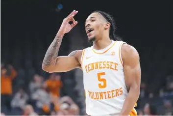  ?? AP PHOTO/ERIC GAY ?? Tennessee junior point guard Zakai Zeigler celebrates after a score during Saturday's game against North Carolina State in San Antonio. Zeigler, whose 2022-23 season was cut short by a torn ACL in late February, played a seasonhigh 38 minutes, 34 seconds as the Vols beat the Wolfpack 79-70.