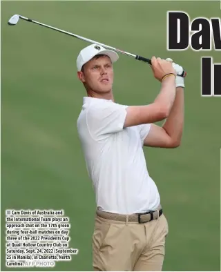  ?? AFP PHOTO ?? Cam Davis of Australia and the Internatio­nal Team plays an approach shot on the 17th green during four-ball matches on day three of the 2022 Presidents Cup at Quail Hollow Country Club on Saturday, Sept. 24, 2022 (September 25 in Manila), in Charlotte, North Carolina.