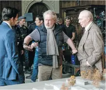  ?? GILES KEYTE/SONY PICTURES ?? Mark Wahlberg, left, Ridley Scott and Christophe­r Plummer plan a scene on the set of All the Money in the World. The reshoot with Plummer took nine days to film.