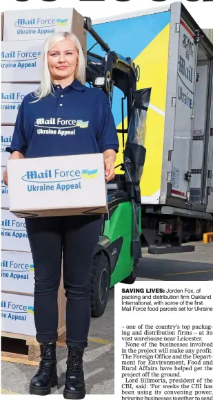  ?? ?? SAVING LIVES: Jorden Fox, of packing and distributi­on firm Oakland Internatio­nal, with some of the first
Mail Force food parcels set for Ukraine