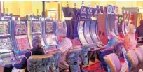  ?? FILE ?? Guests play slot machines at the Seminole Hard Rock Hotel & Casino in Hollywood.