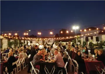  ?? Courtesy photo ?? (Above) The WiSH Education Foundation was the beneficiar­y of “Wine on the Roof,” a fundraiser hosted at the Westfield Valencia Town Center mall on May 17. The event brought together local vintners, brewers and chefs who came together to pair their...