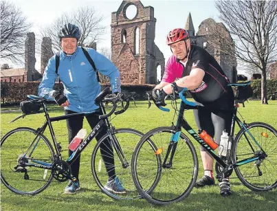  ??  ?? Ewen Chalmers, right, who nearly lost his leg following a cycling accident, and friend Colin Grant are taking part in tomorrow’s Etape Loch Ness to raise charity cash. Picture: Wallace Ferrier.