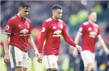  ??  ?? Manchester United’s Alexis Sanchez (left) leaves the pitch dejected after the final whistle during the English Premier League match against West Bromwich Albion at Old Trafford, Manchester, England, yesterday. West Brom won 1-0, handing the league...